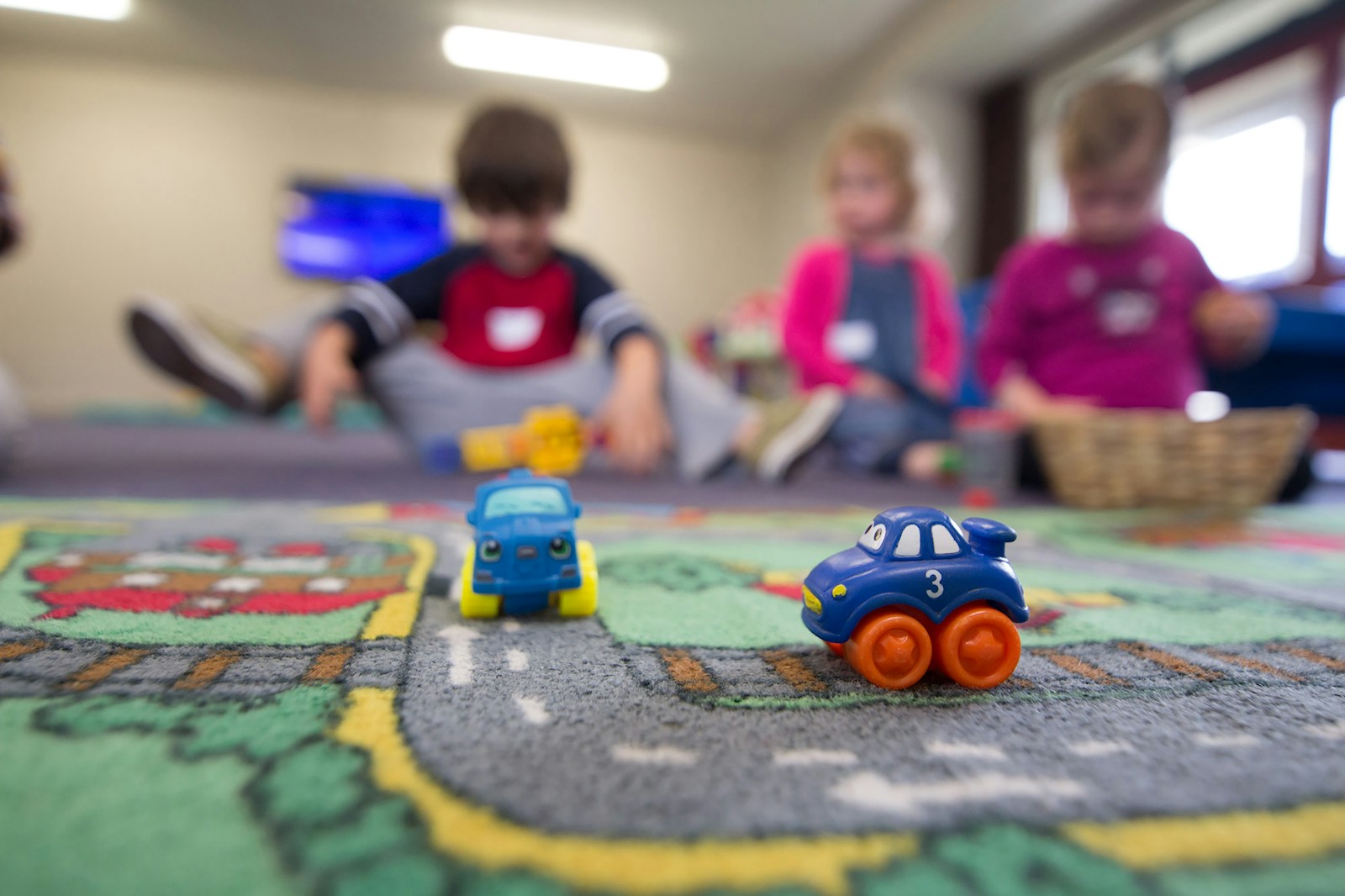 Graduation-Rhema-Haïti-2018-Web-6501 a group of children playing with toys on the floor
